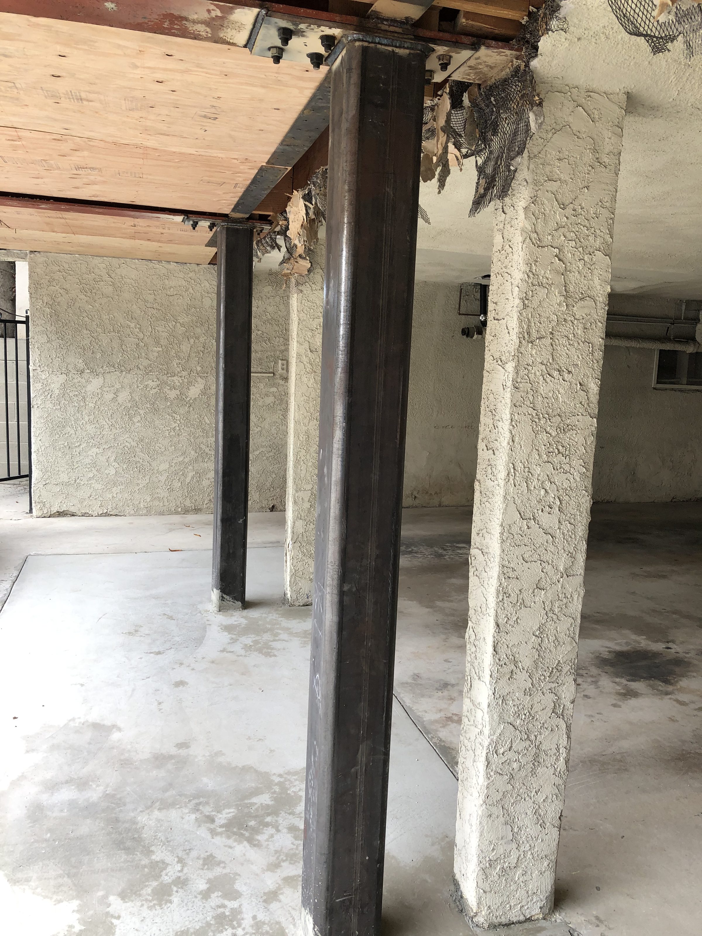 Steel columns installed โ new slab and soffit lath