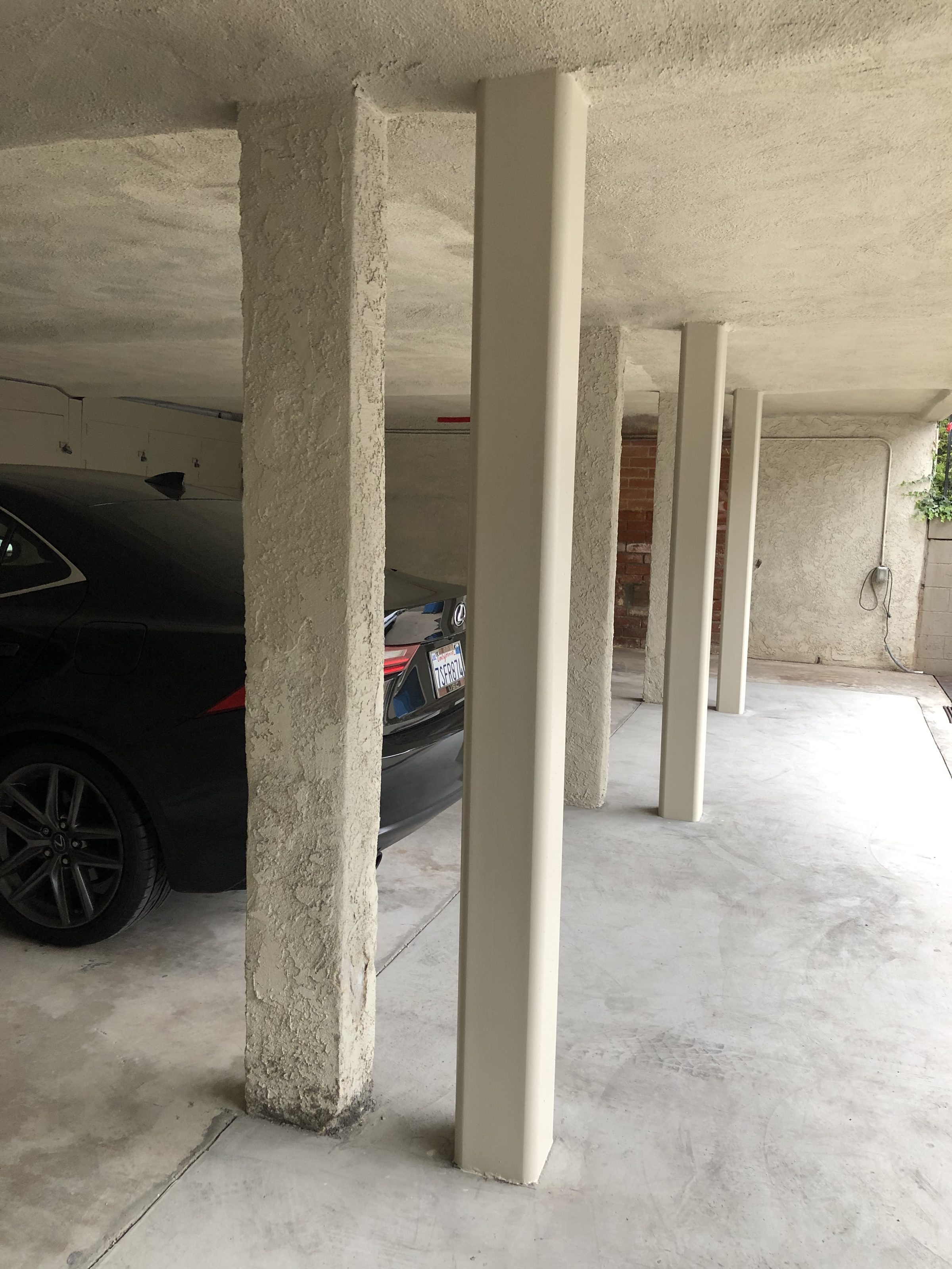 Completed garage โ new stucco columns blending with existing