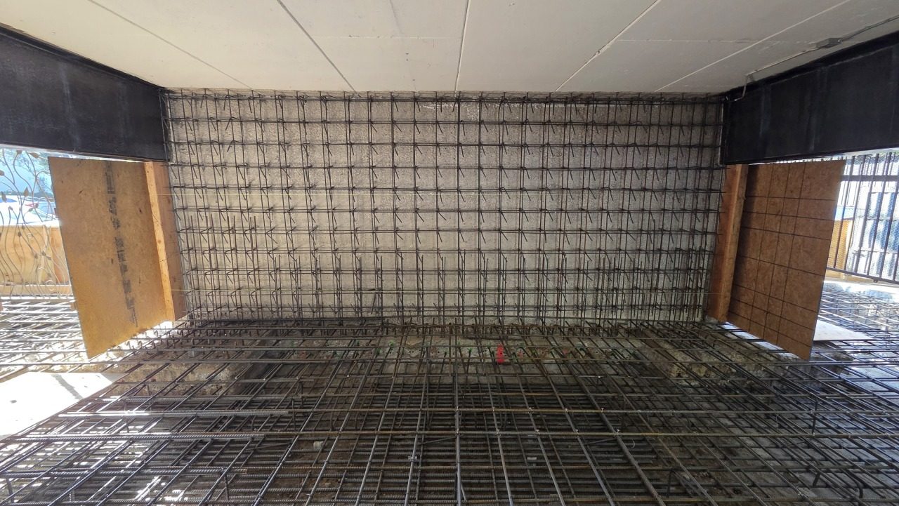Rebar shear wall and slab formwork — looking in from exterior