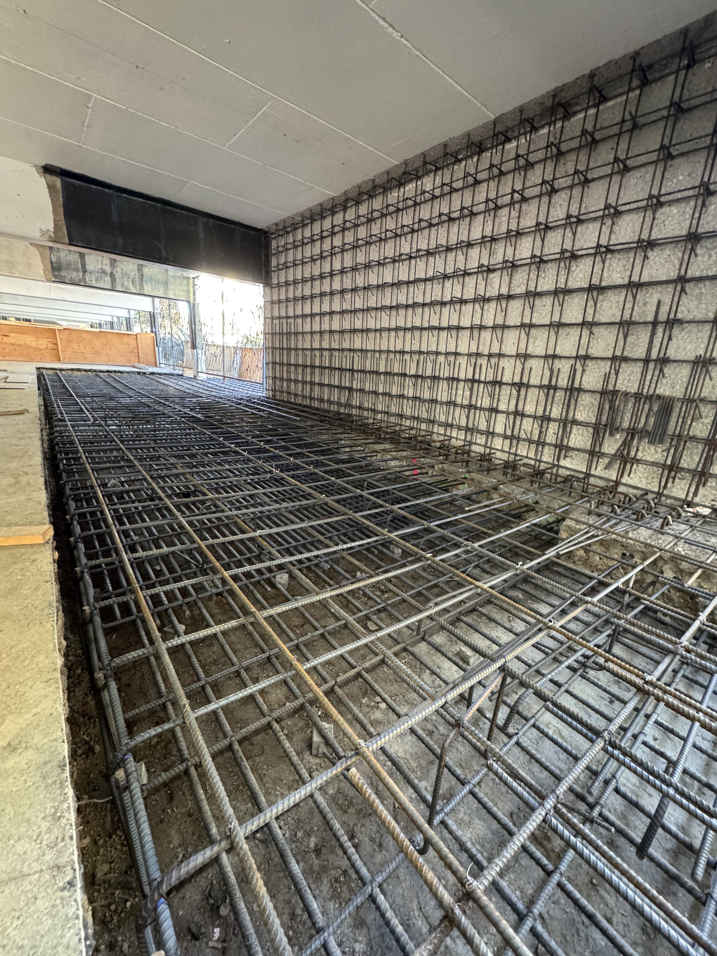 Rebar shear wall under construction — parking level