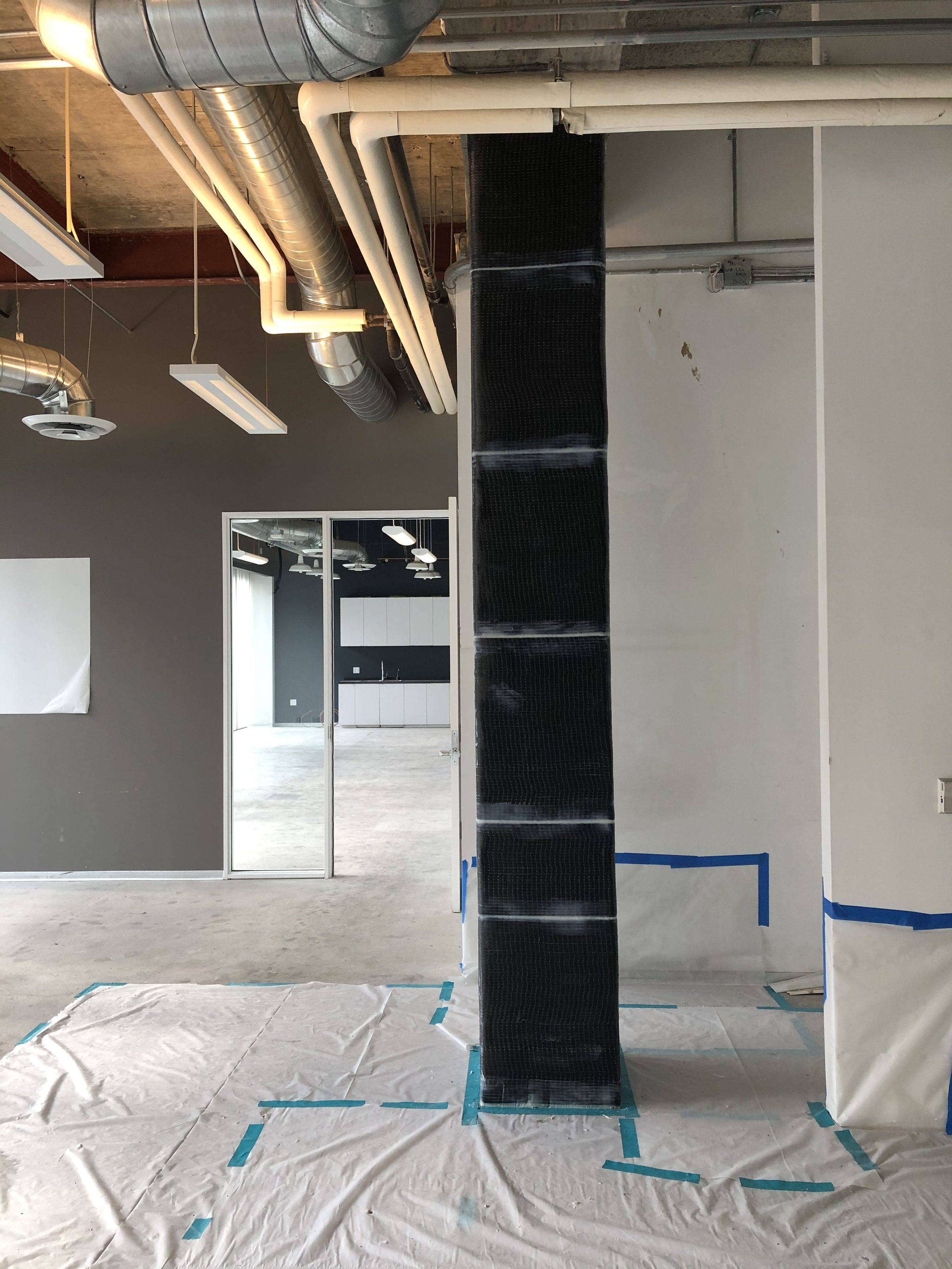 Interior rebar wall — mid-construction with MEP rough-in