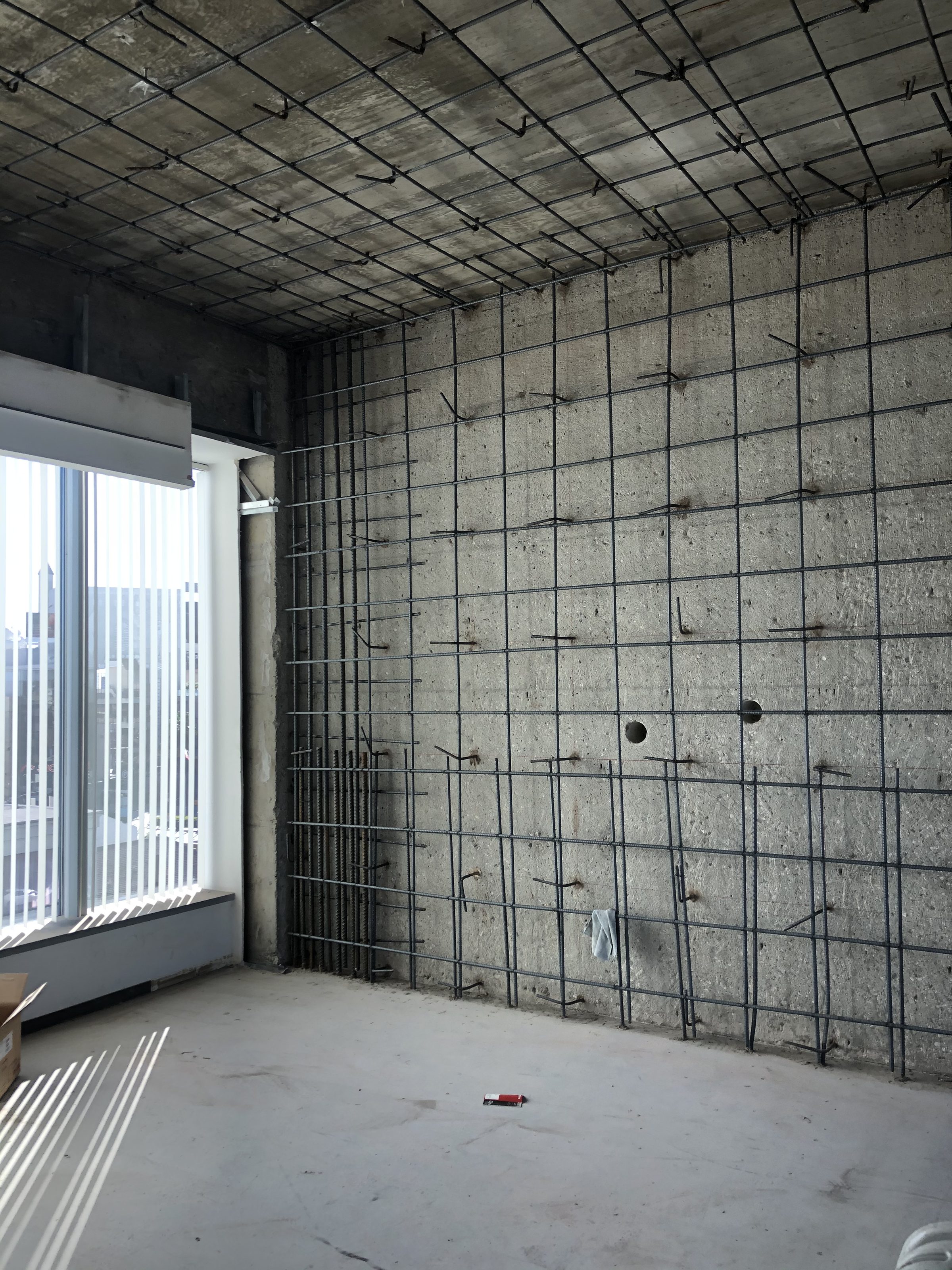 Rebar wall and ceiling reinforcement — interior office floor