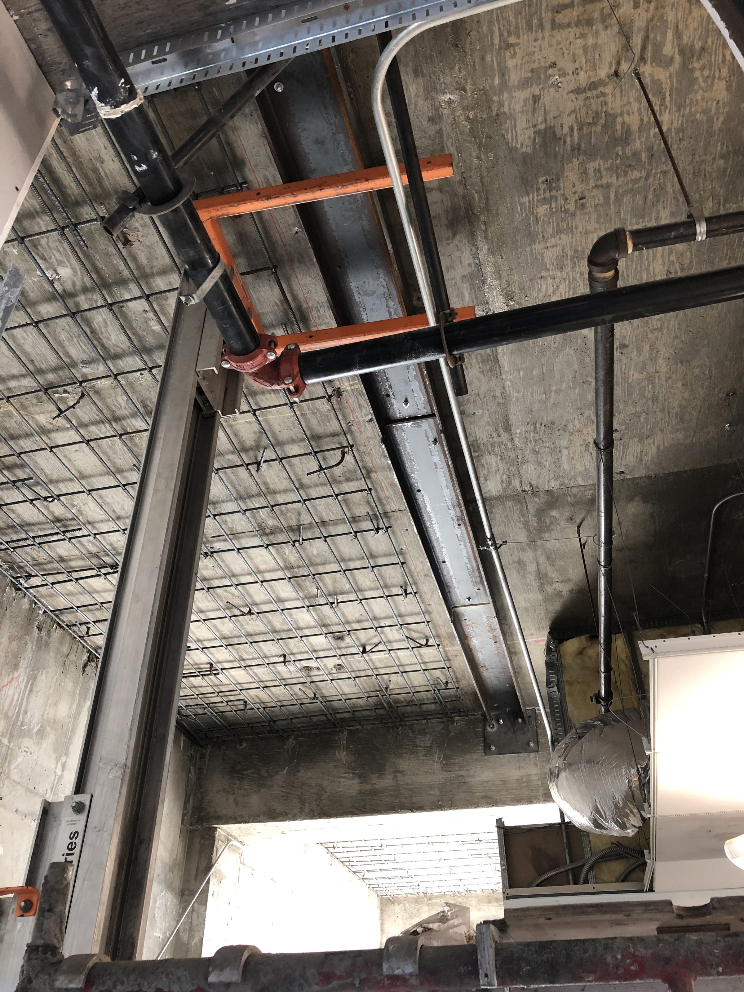 Interior rebar and steel framing — overhead view