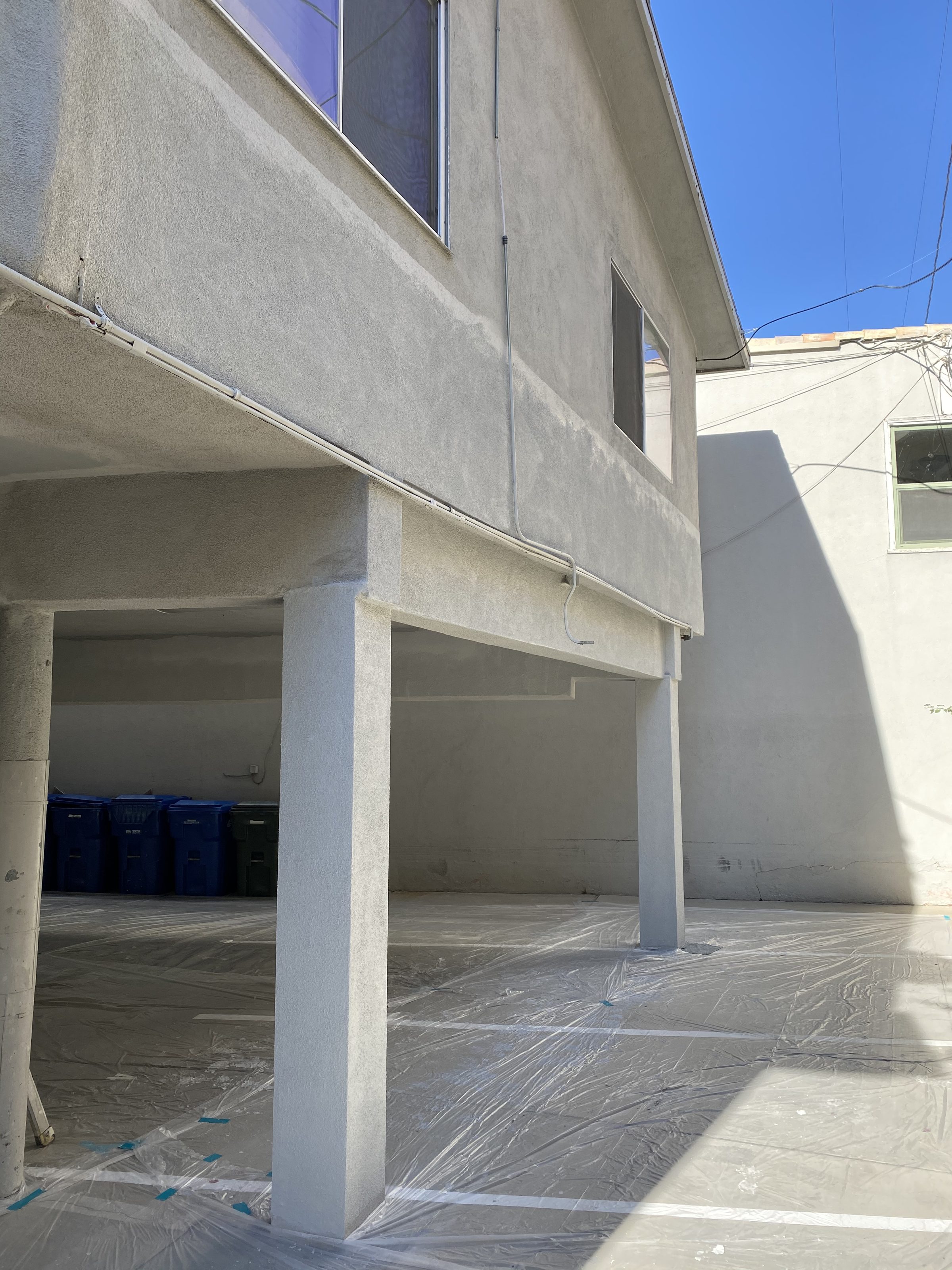Completed exterior โ new stucco columns and soffit