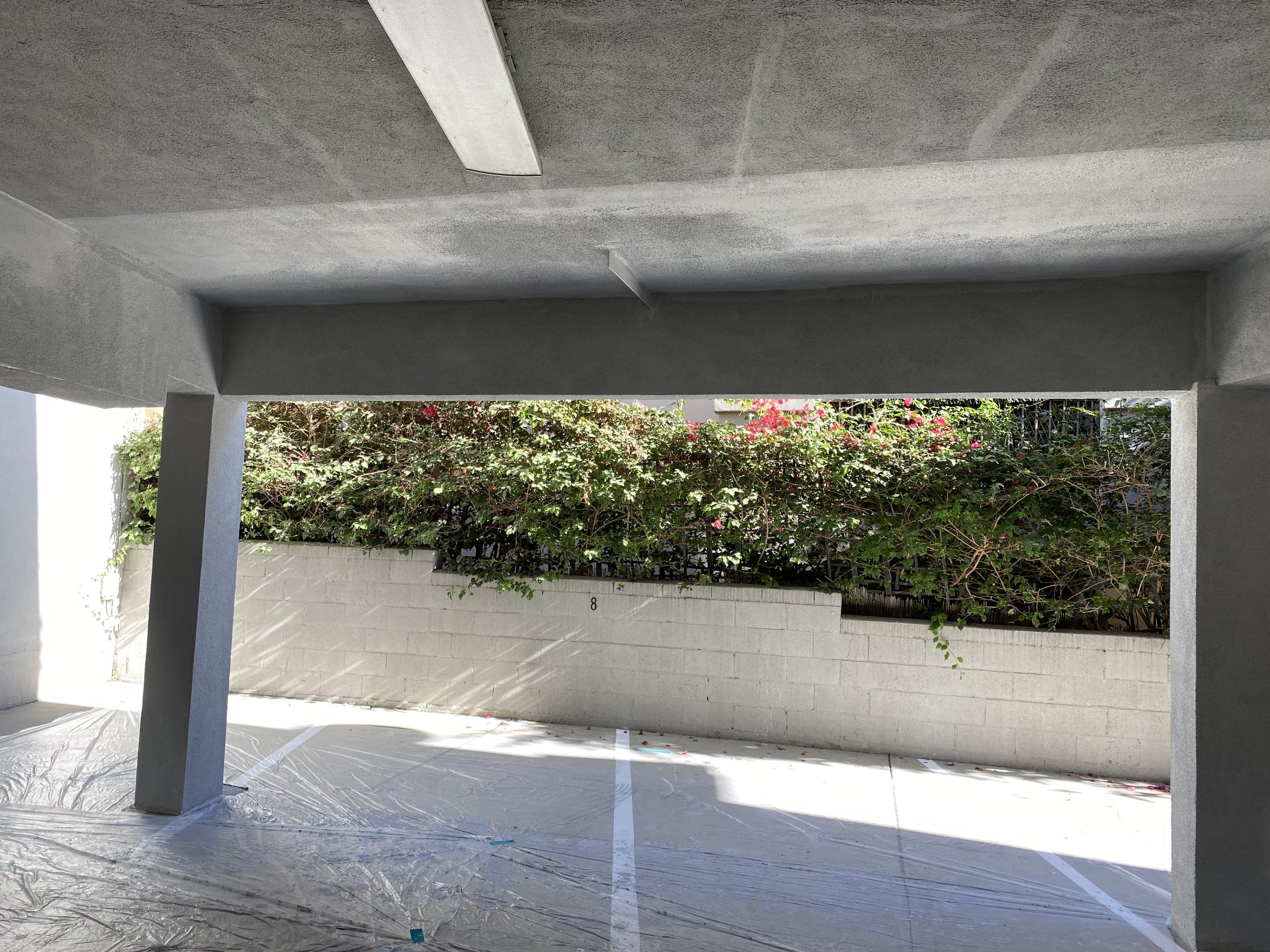 Completed moment frame โ beam and column stucco finish