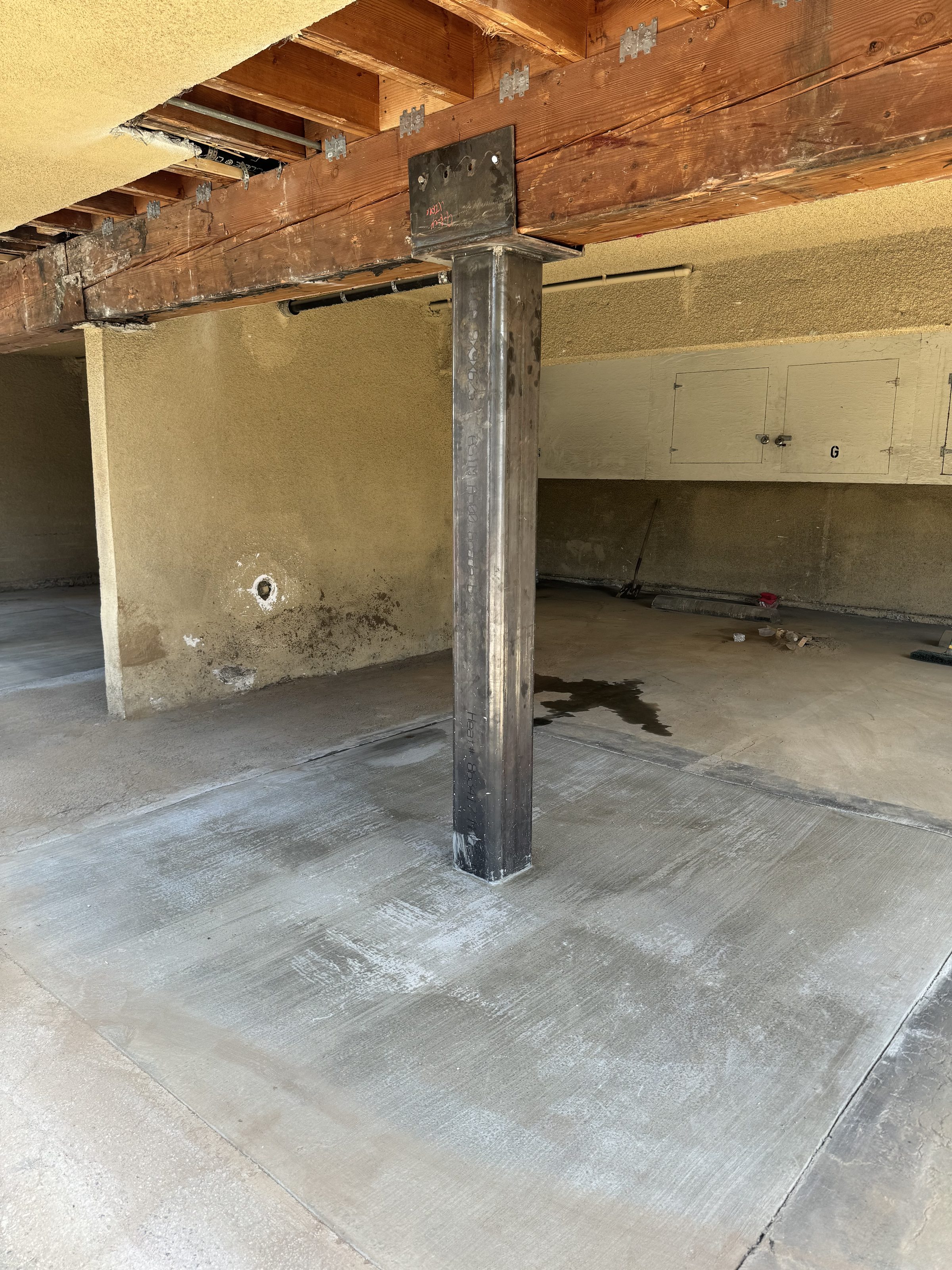 Completed steel column with base plate โ new slab poured