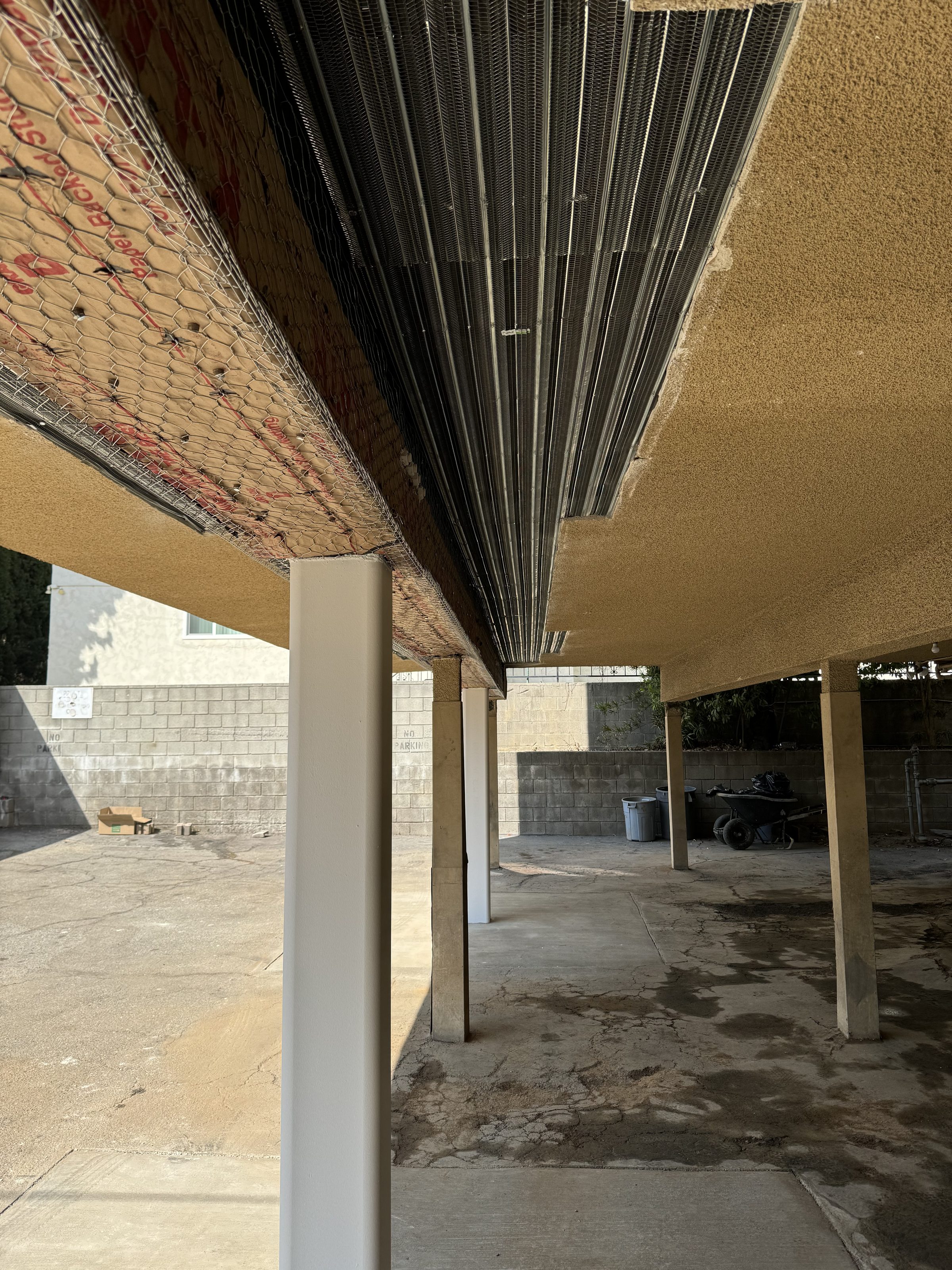 Steel beam and lath โ soffit framing in progress