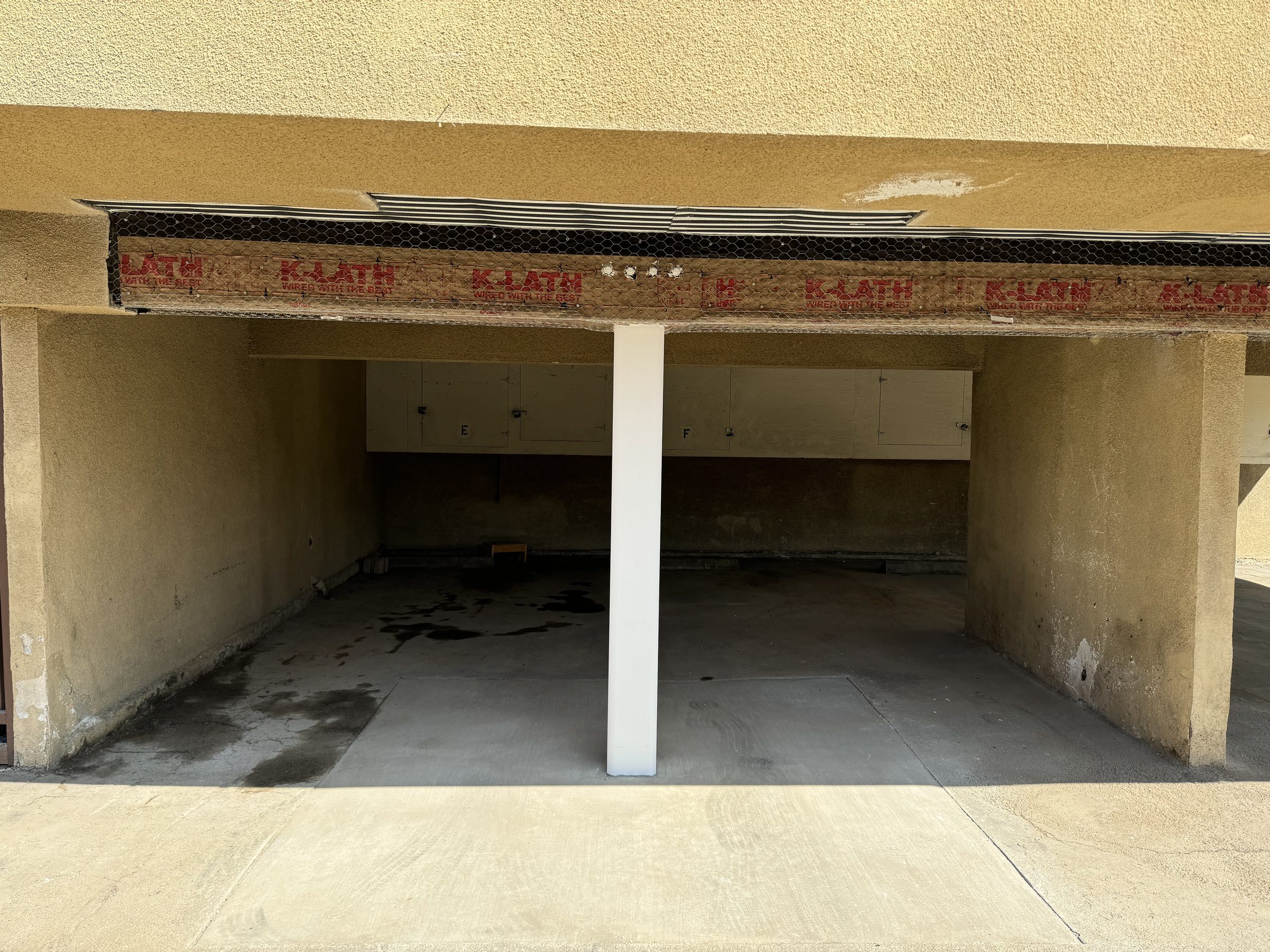 Completed moment frame โ stucco soffit and new column